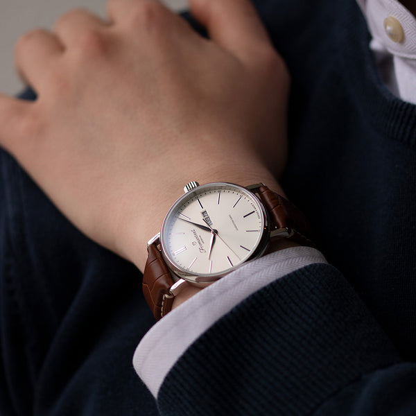 "Fromanteel day-date white watch elegantly displayed on a male wrist, showcasing its timeless design and sophisticated day and date function."