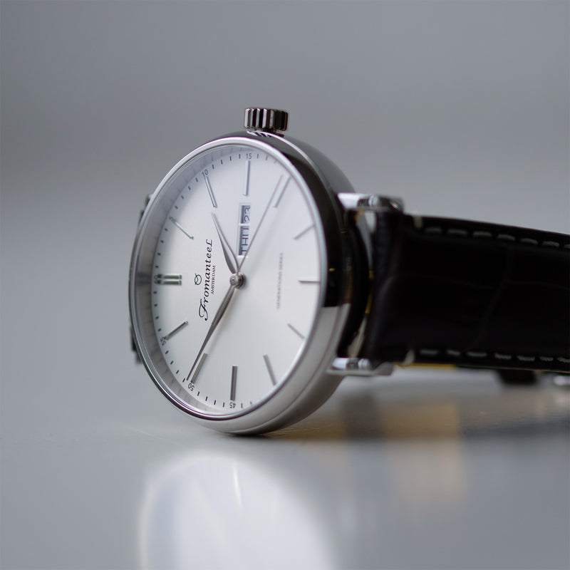 Fromanteel Day-Date white watch with a sleek design showcased against a pristine white background